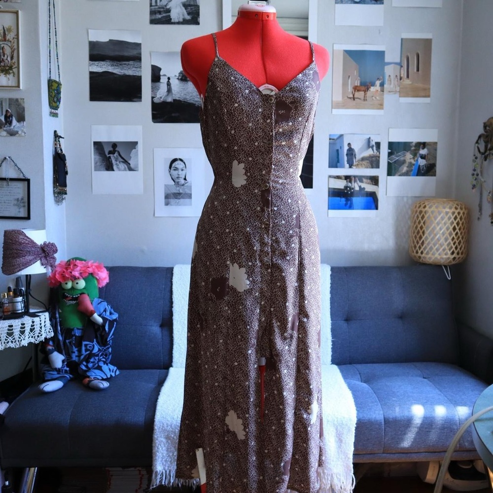 Sienna Sky brown long dress with white flowers.